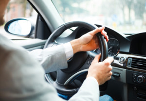 Photo of hands on a steering wheel