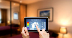 Image of a person using a smart home app on a tablet
