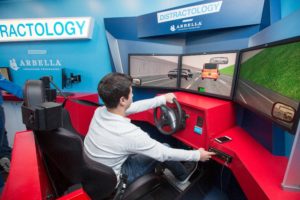 Photo of a young man using a driving simulator